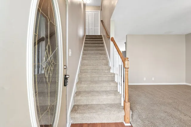 a view of staircase with white walls