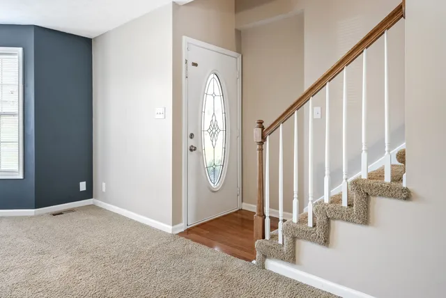 a view of a hallway with staircase