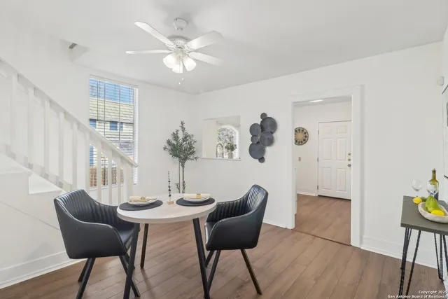 a dining room with furniture and window