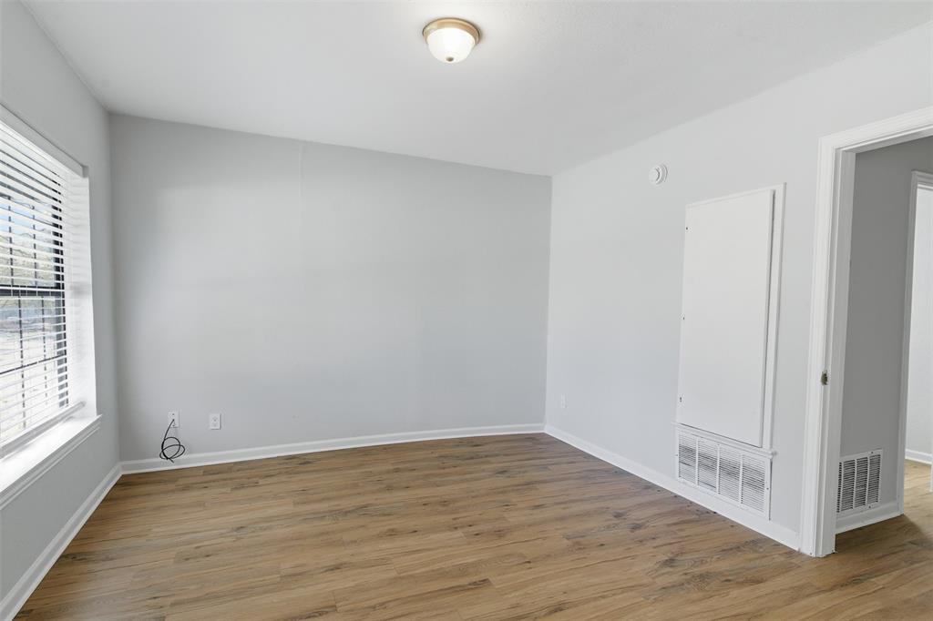 215 North Morrow Street Blue Ridge, TX 75424 - Photo 11 of 23 Spare room with light wood finished floors and baseboards
