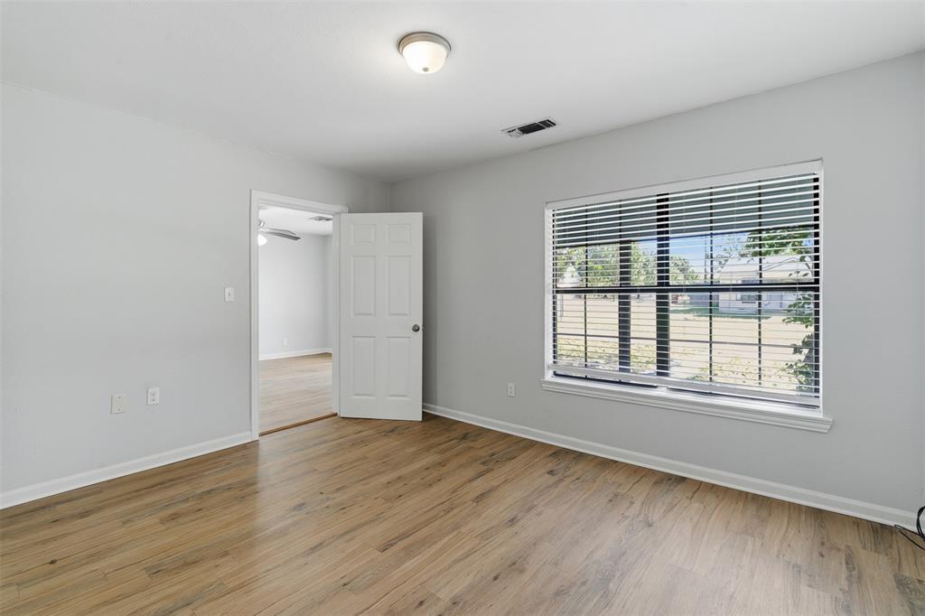 215 North Morrow Street Blue Ridge, TX 75424 - Photo 13 of 23 Unfurnished room with light wood-type flooring