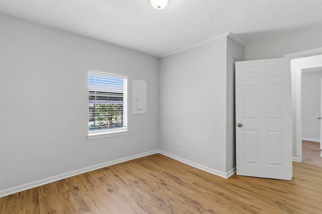 215 North Morrow Street Blue Ridge, TX 75424 - Photo 15 of 23 Spare room with baseboards and light wood-type flooring
