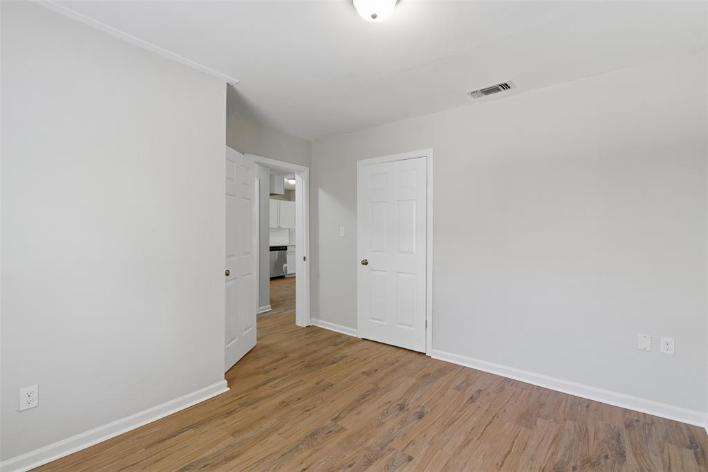 215 North Morrow Street Blue Ridge, TX 75424 - Photo 16 of 23 Spare room featuring light wood-style flooring and baseboards