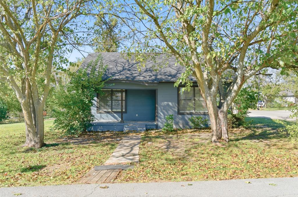 215 North Morrow Street Blue Ridge, TX 75424 - Photo 2 of 23 View of front of home with a front yard and roof with shingles
