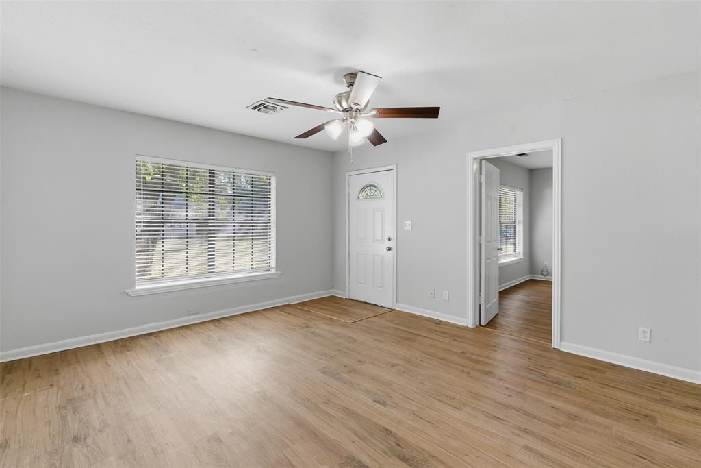 215 North Morrow Street Blue Ridge, TX 75424 - Photo 8 of 23 Foyer entrance with light wood finished floors and ceiling fan