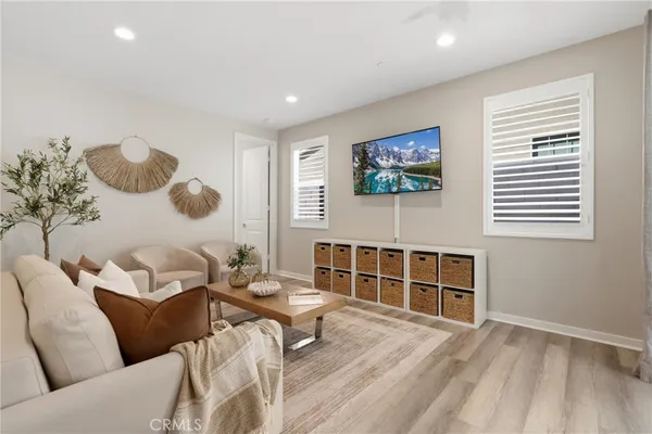 a bedroom with a bed and a painting on the wall