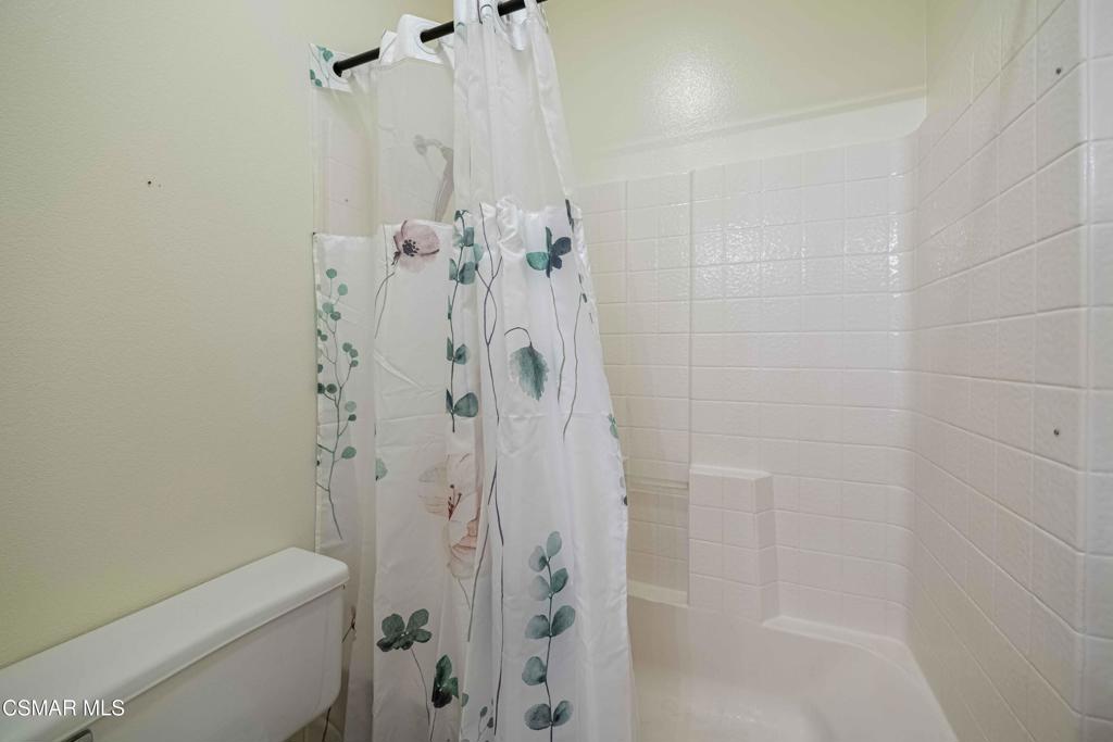 580 Fenwick Way, Unit C Simi Valley, CA 93065 - Photo 33 of 39 a bathroom with a shower curtain