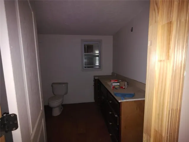 a room with a bench and cabinets