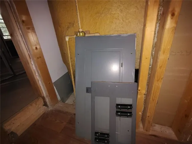 a bathroom with a shower and a glass door