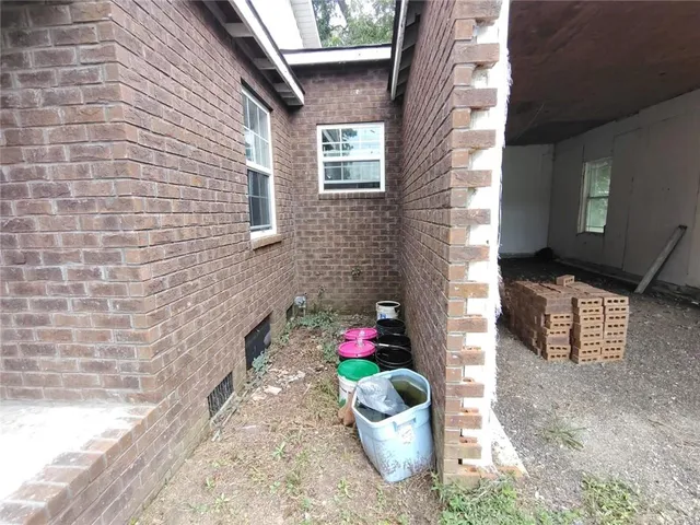 a view of a backyard with large trees