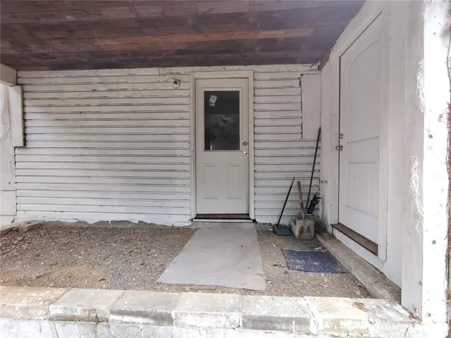 a view of a yard with large trees