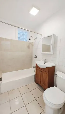 a bathroom with a bathtub toilet and sink