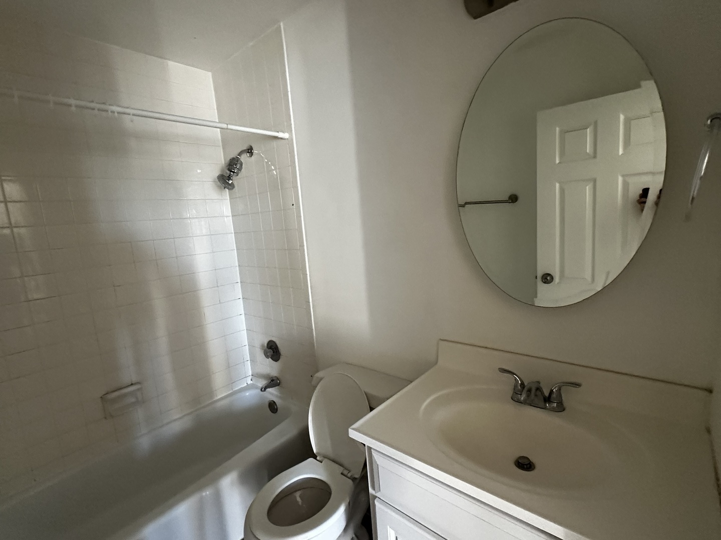 425 Walnut Creek Road, Unit 1608 Lisle, IL 60532 - Photo 11 of 13 a bathroom with a sink a toilet and a mirror