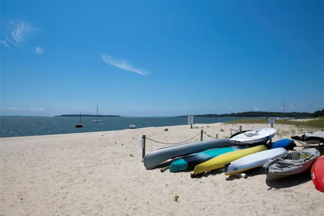 a living room with furniture and a kitchen