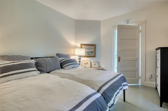 a bedroom with a bed and a cabinets