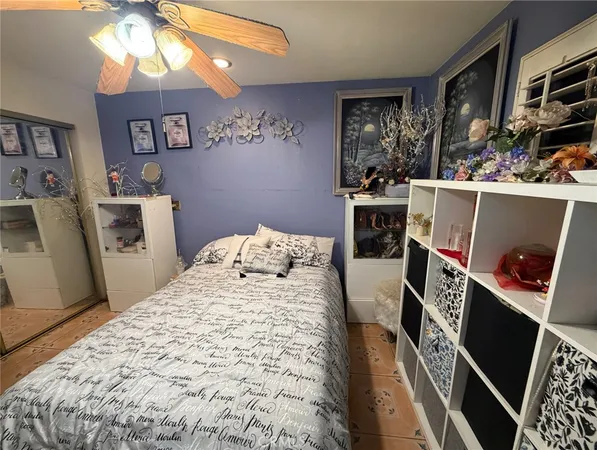 a very nice looking bedroom with a bed and a flat screen tv