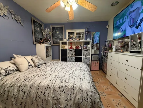 a bedroom with a large bed and a cabinets