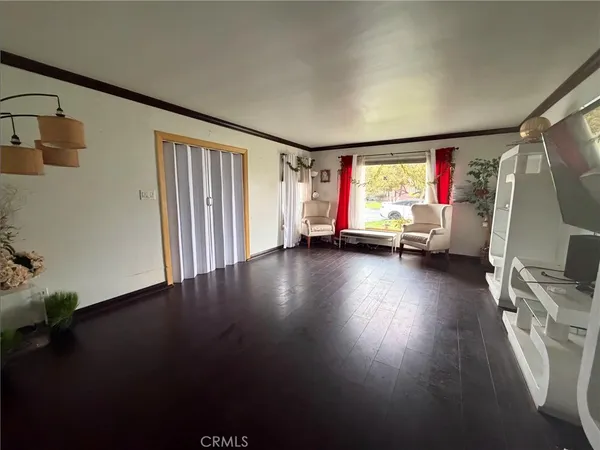 a view of livingroom with furniture wooden floor and window