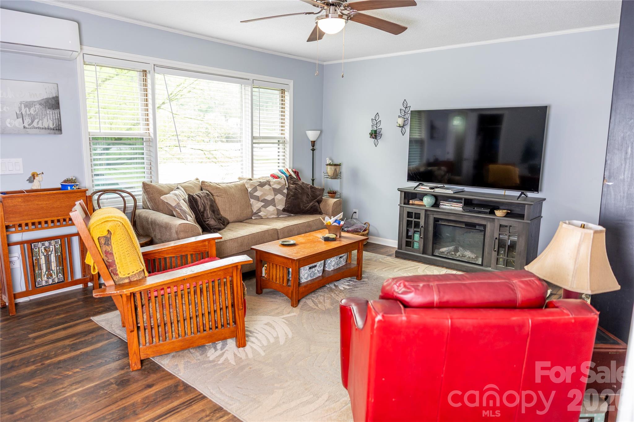 57 Gribble Road Franklin, NC 28734 - Photo 16 of 39 a living room with furniture and a flat screen tv