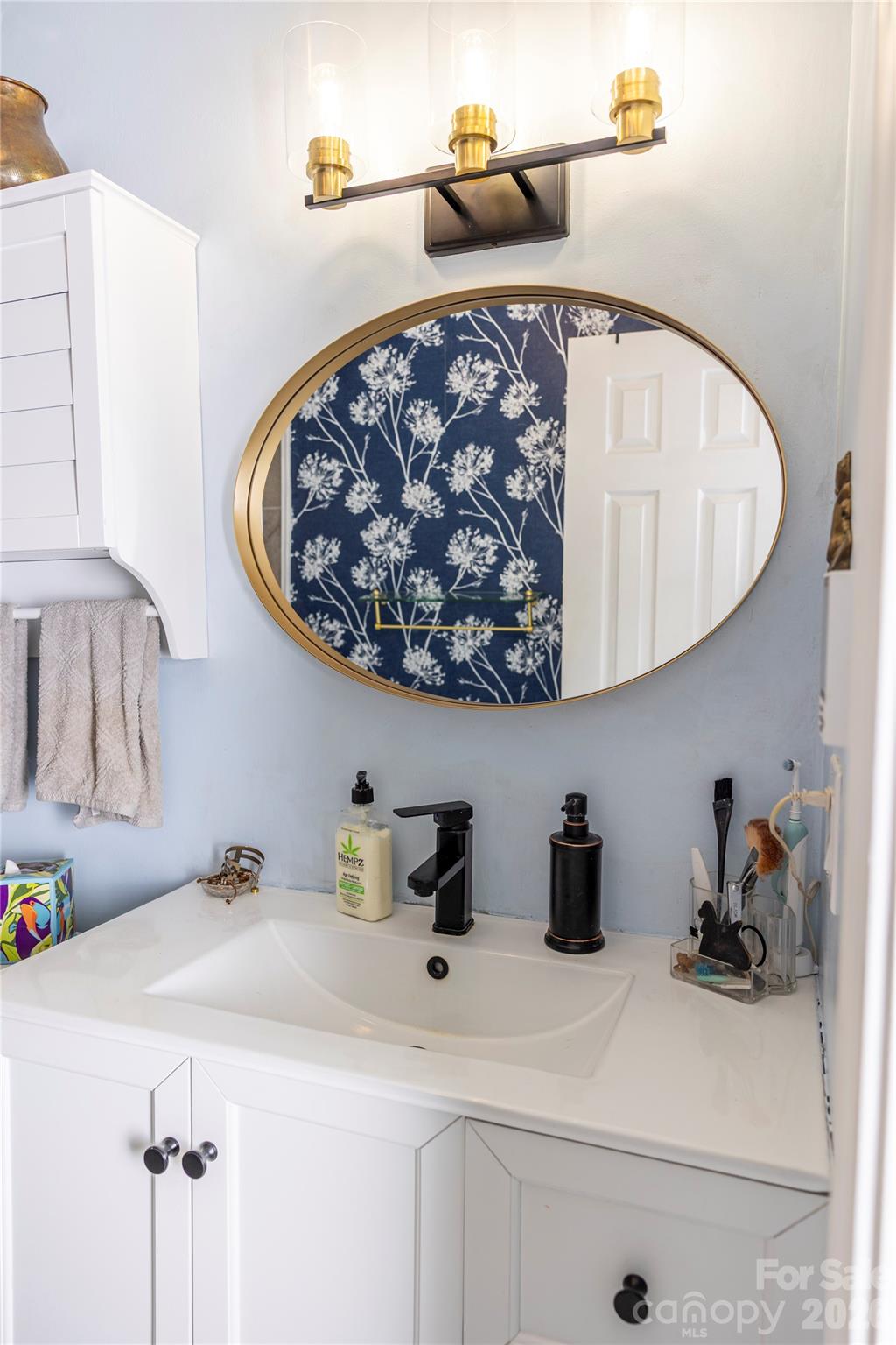 57 Gribble Road Franklin, NC 28734 - Photo 25 of 39 a bathroom with a sink and a mirror