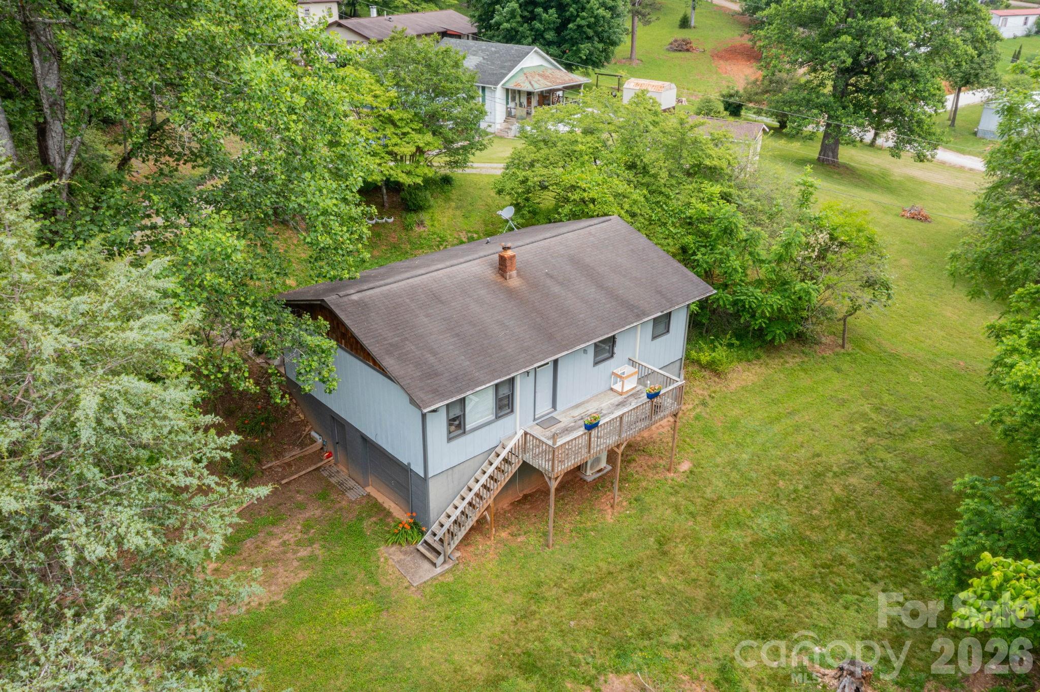 57 Gribble Road Franklin, NC 28734 - Photo 8 of 39 an aerial view of a house with swimming pool