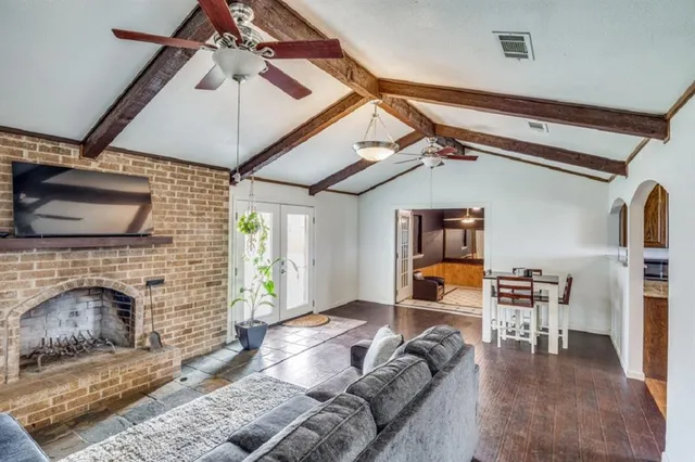 a bedroom with furniture and a fireplace