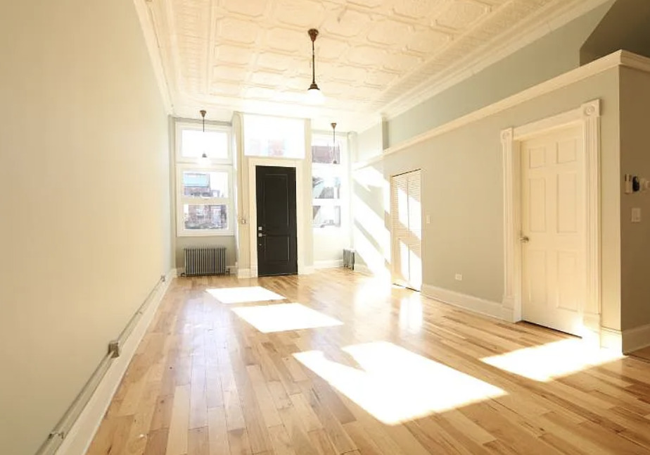 1316 West Erie Street, Unit 1E Chicago, IL 60642 - Photo 3 of 12 a bathroom with a sink and a shower