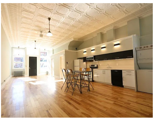 1316 West Erie Street, Unit 1E Chicago, IL 60642 - Photo 4 of 12 a view of a room with furniture and wooden floor