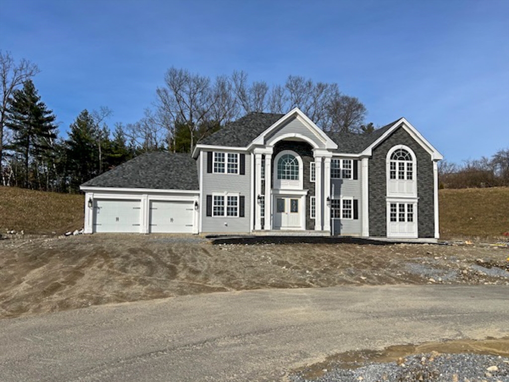 11 Ayer Road Littleton, MA 01460 - Photo 1 of 42 a front view of a house with a yard