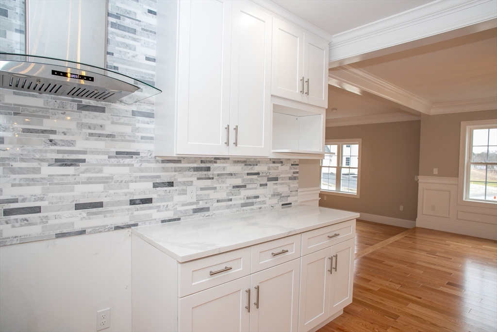 11 Ayer Road Littleton, MA 01460 - Photo 17 of 42 a kitchen with granite countertop white cabinets and white appliances
