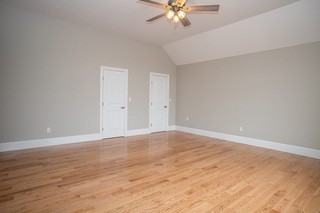 11 Ayer Road Littleton, MA 01460 - Photo 29 of 42 a view of an empty room with wooden floor