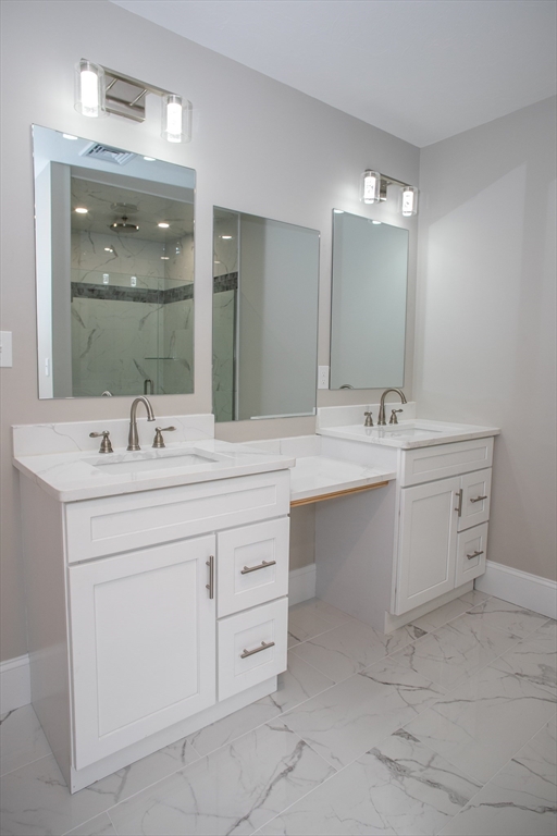 11 Ayer Road Littleton, MA 01460 - Photo 32 of 42 a bathroom with a sink vanity and mirror