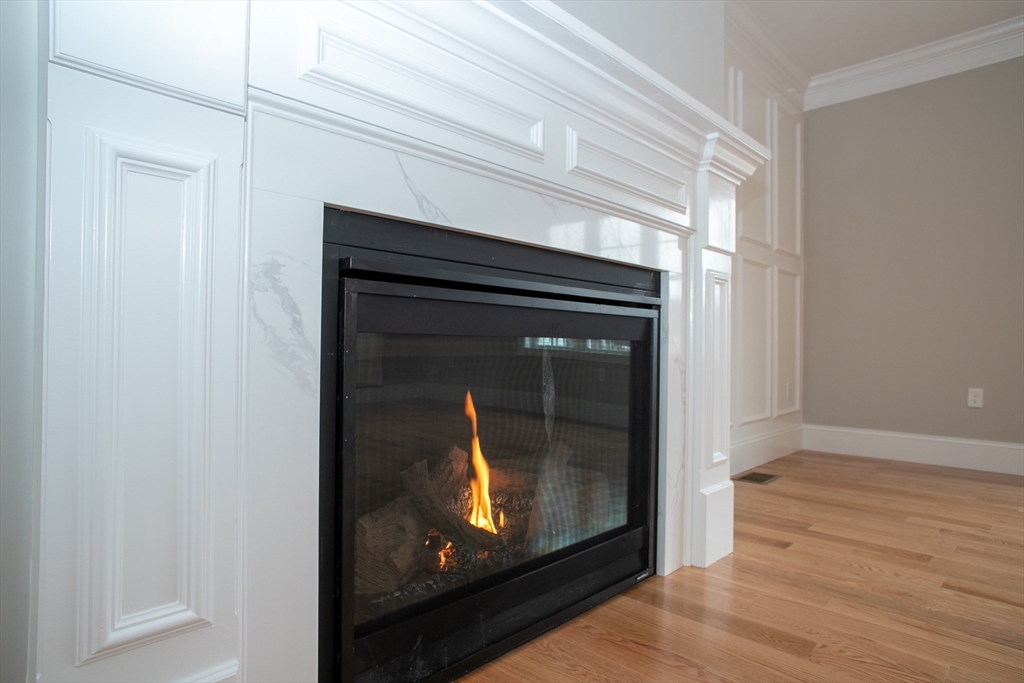 11 Ayer Road Littleton, MA 01460 - Photo 7 of 42 a view of fireplace with wooden floor