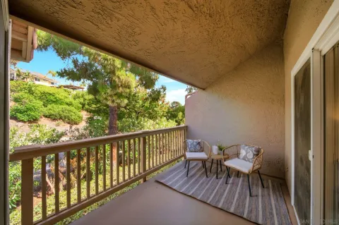 a view of balcony with furniture