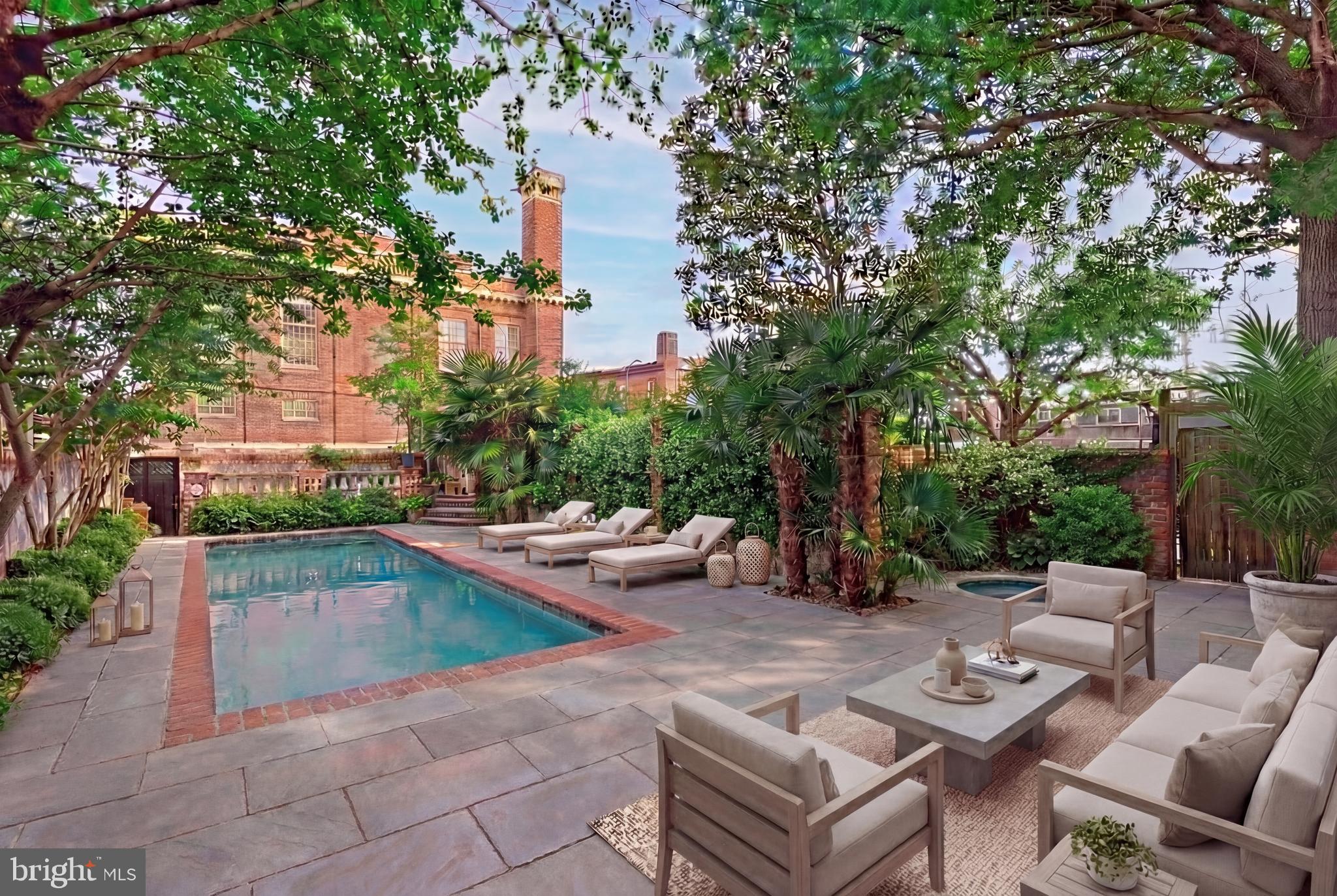 1827 13th Street Northwest Washington, DC 20009 - Photo 13 of 23 a view of a patio with couches and chairs under an umbrella