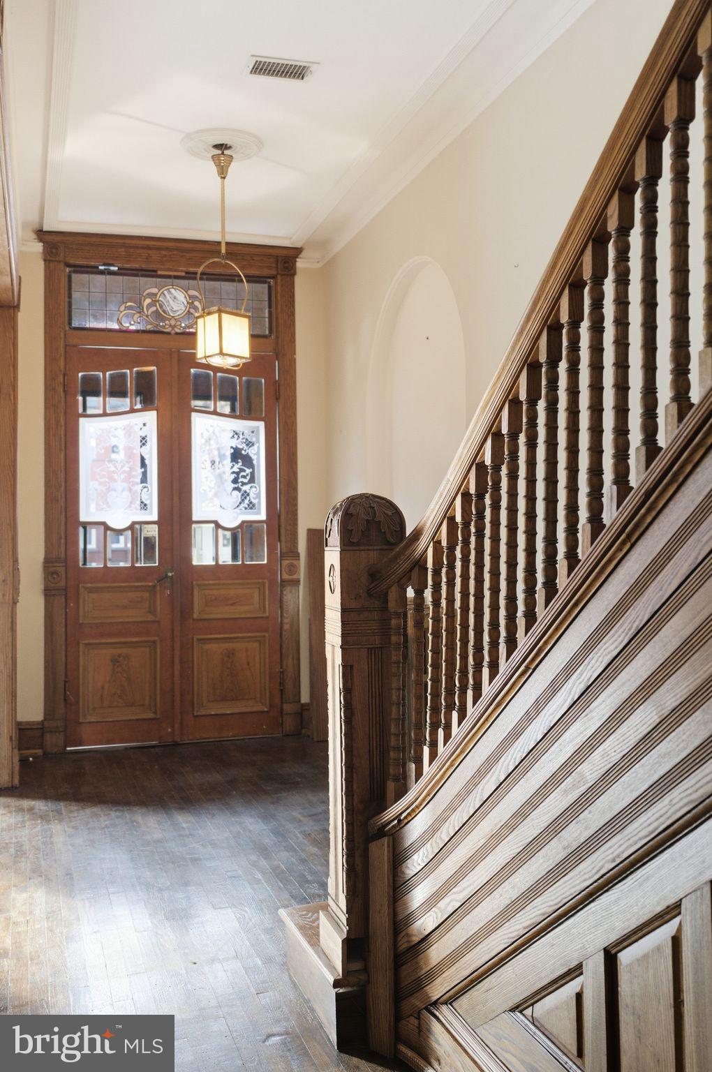 1827 13th Street Northwest Washington, DC 20009 - Photo 19 of 23 a view of a hallway with entryway wooden floor and front door