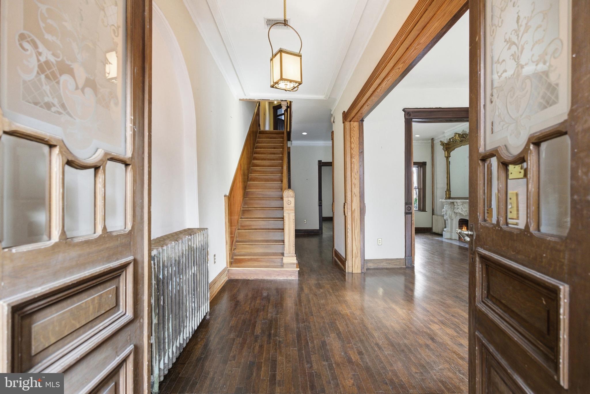 1827 13th Street Northwest Washington, DC 20009 - Photo 2 of 23 a view of a hallway with wooden floor and staircase