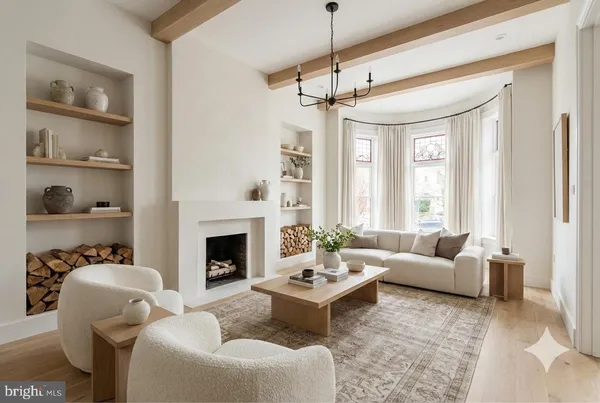 a living room with furniture fireplace and a window