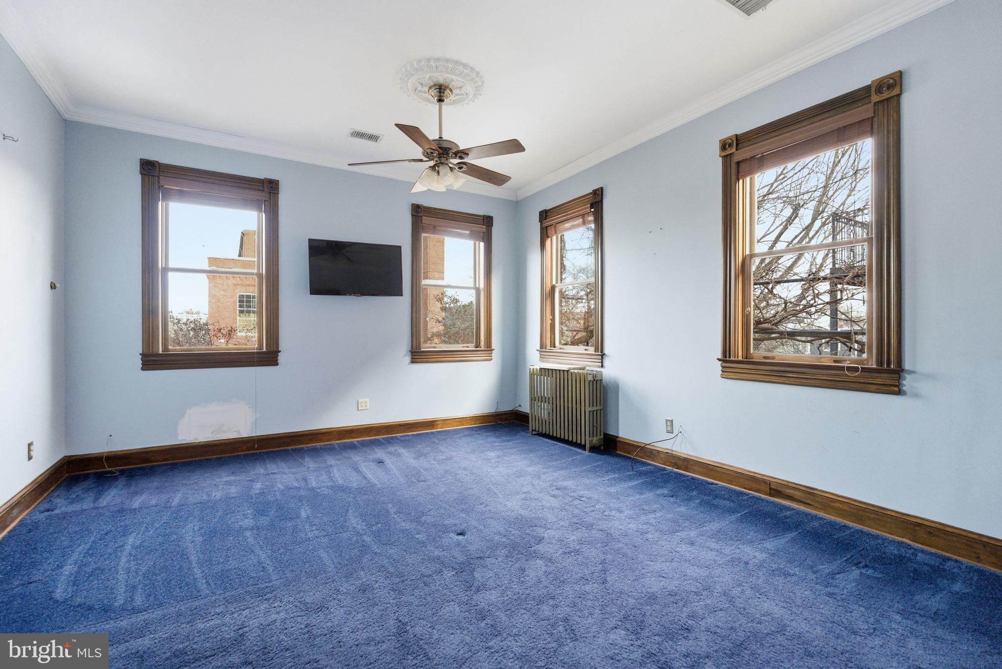1827 13th Street Northwest Washington, DC 20009 - Photo 8 of 23 a view of an empty room with a window and wooden floor