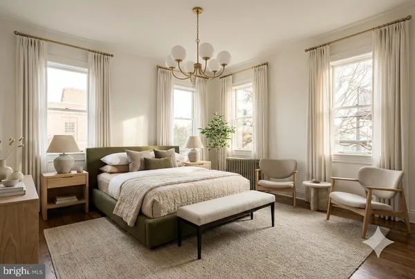 a spacious bedroom with a bed and a chandelier
