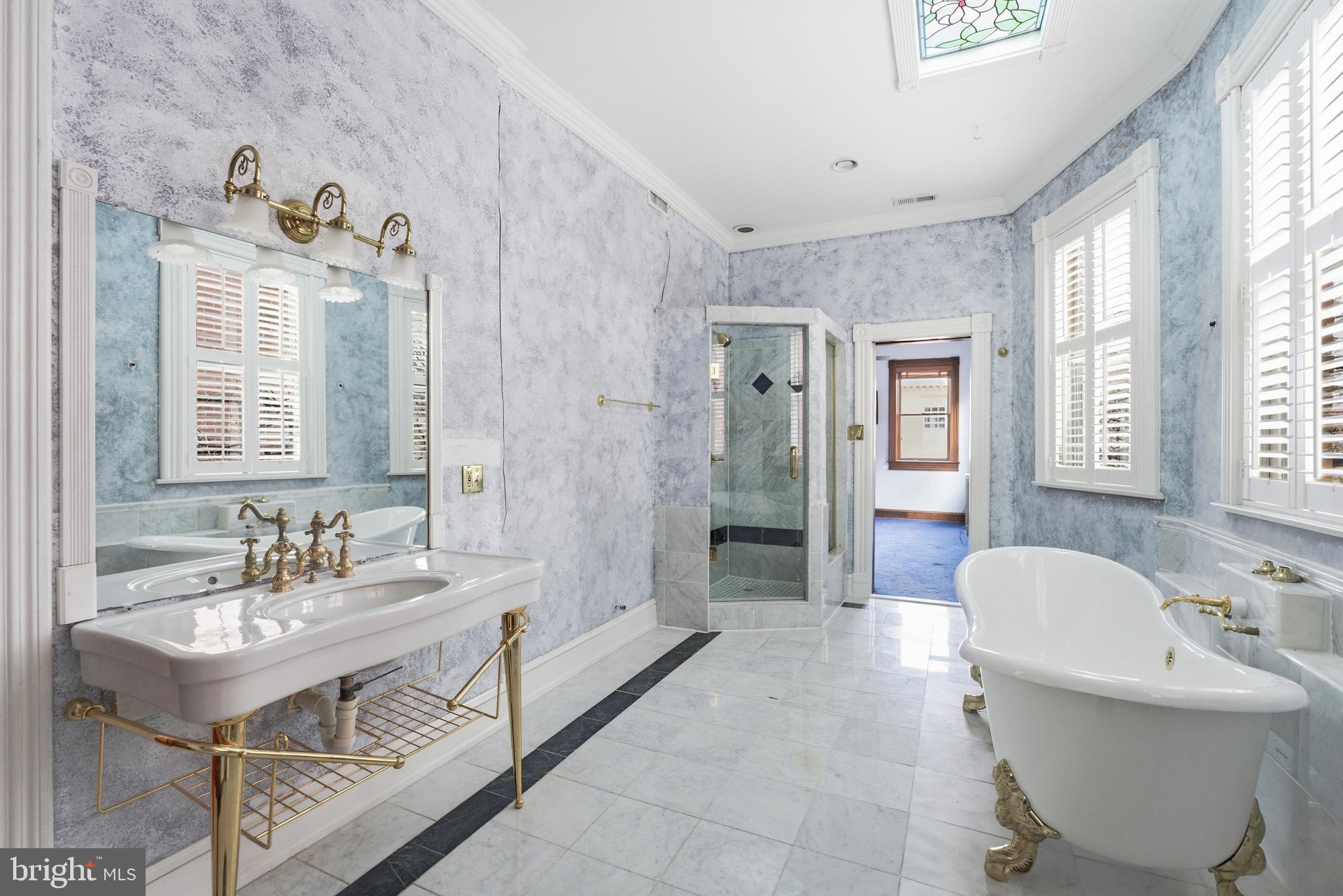 1827 13th Street Northwest Washington, DC 20009 - Photo 10 of 23 a bath room with a sink mirror and a bathtub