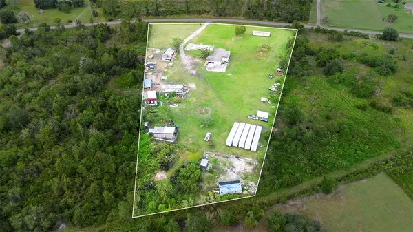 a view of a swimming pool with a yard