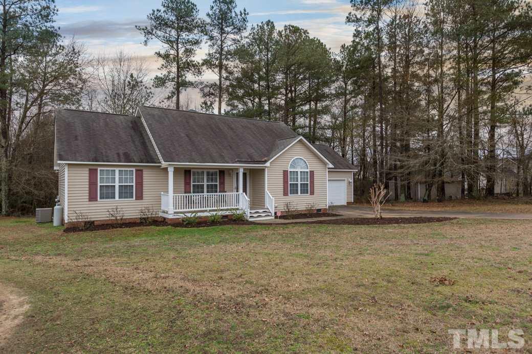 552 Axum Road Willow Spring, NC 27592 - Photo 23 of 25 The front yard is ready for any landscaping you desire!