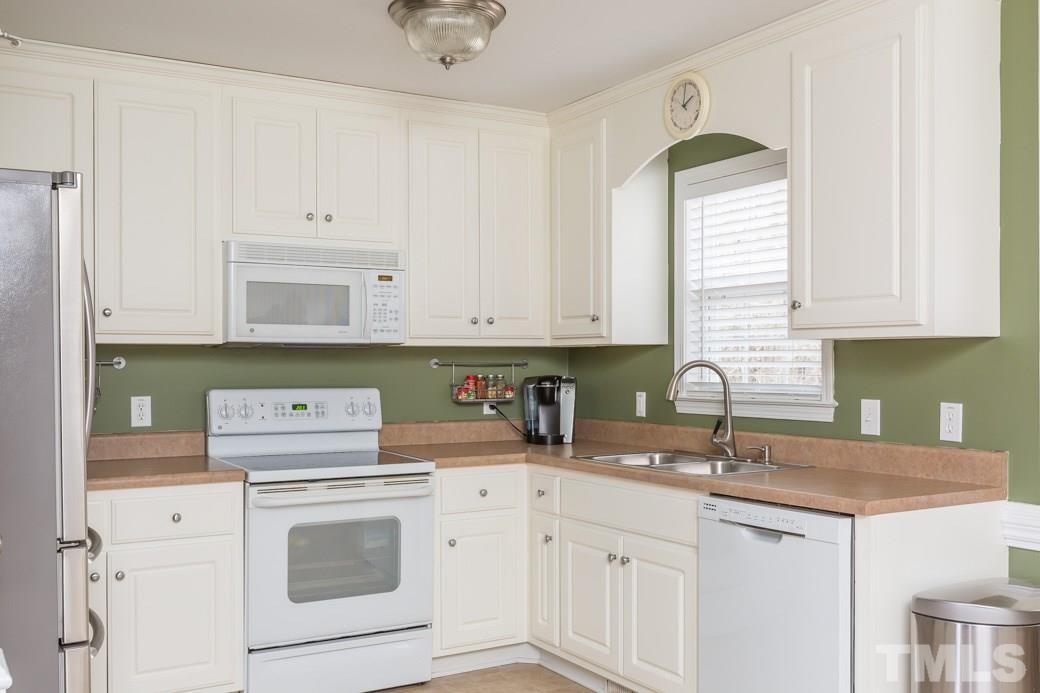 552 Axum Road Willow Spring, NC 27592 - Photo 4 of 25 Enjoy your lovely backyard view from the kitchen window!