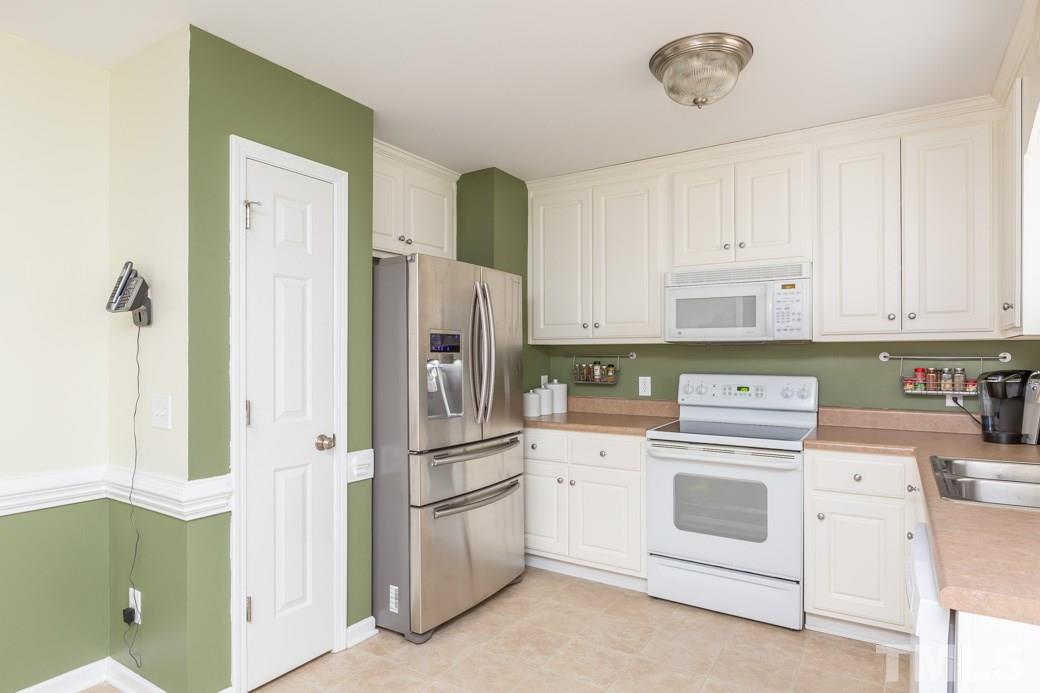 552 Axum Road Willow Spring, NC 27592 - Photo 6 of 25 The pantry provides more storage space