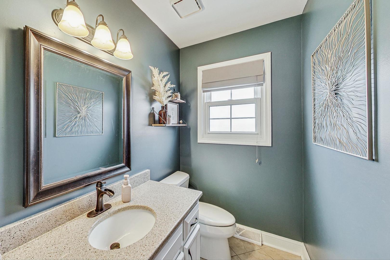 1345 East Bailey Road Naperville, IL 60565 - Photo 16 of 49 a bathroom with a toilet a sink and mirror