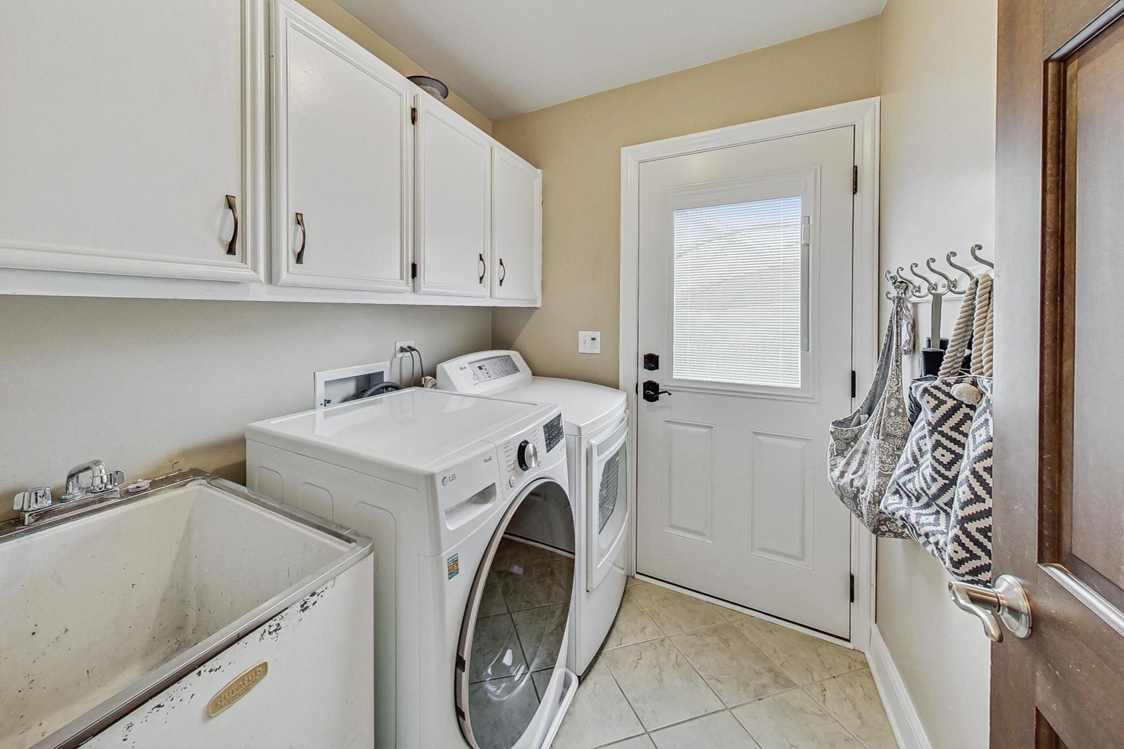 1345 East Bailey Road Naperville, IL 60565 - Photo 17 of 49 a utility room with dryer and washer