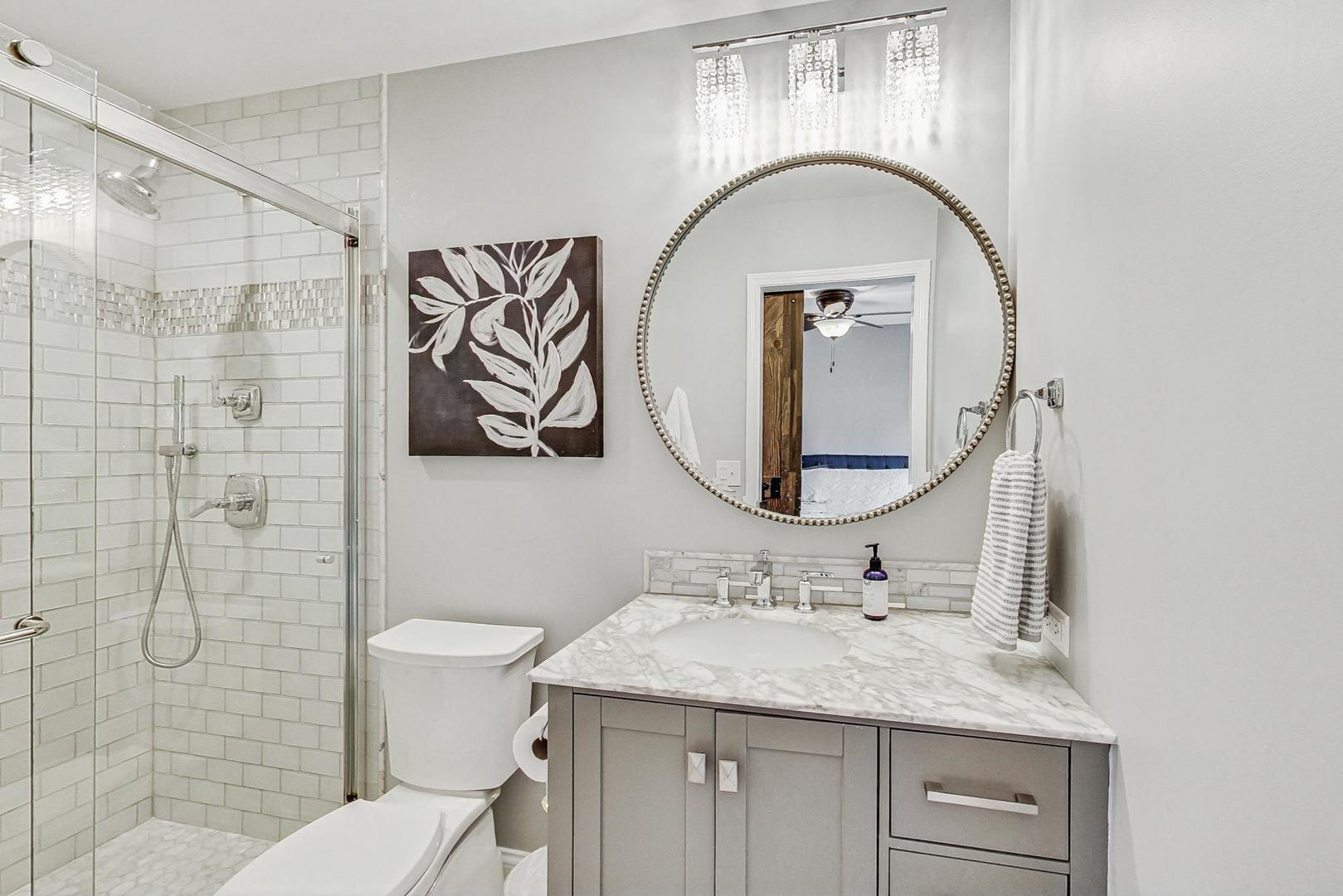 1345 East Bailey Road Naperville, IL 60565 - Photo 22 of 49 a bathroom with a sink a toilet and a mirror