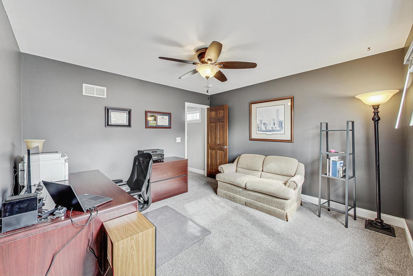 1345 East Bailey Road Naperville, IL 60565 - Photo 26 of 49 a living room with furniture and a ceiling fan