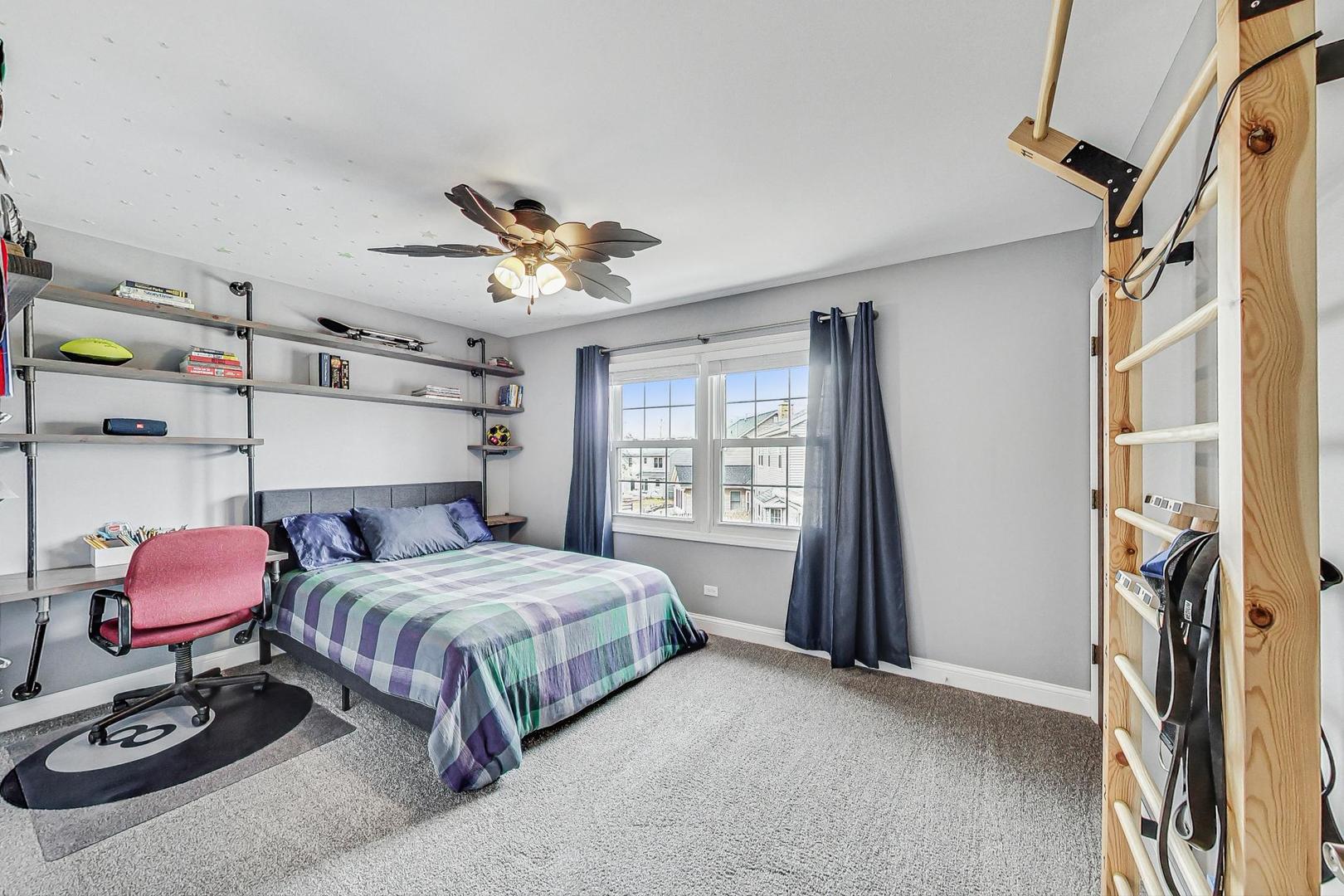 1345 East Bailey Road Naperville, IL 60565 - Photo 27 of 49 a bedroom with a bed and a chair with the potted plant